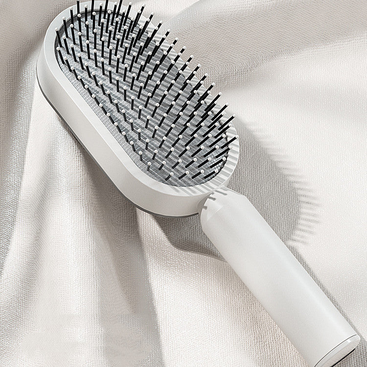 Brosse à cheveux autonettoyante avec massage du cuir chevelu